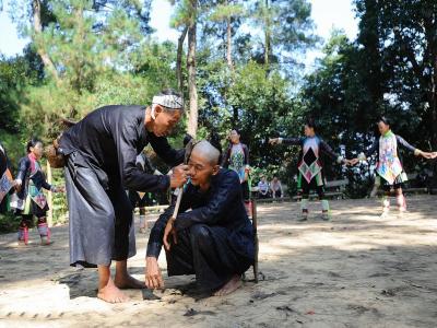 Haircut of man in Basha Miao Village