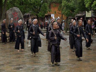 Man with their guns in Basha Miao Village